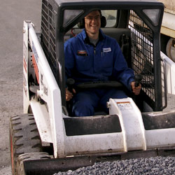 A Photo of David in the skid-steer loader.