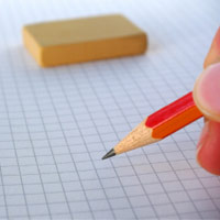 A pencil ready to brainstorm ideas on graph paper.