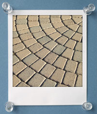 A photos of a complex paving stone pattern.